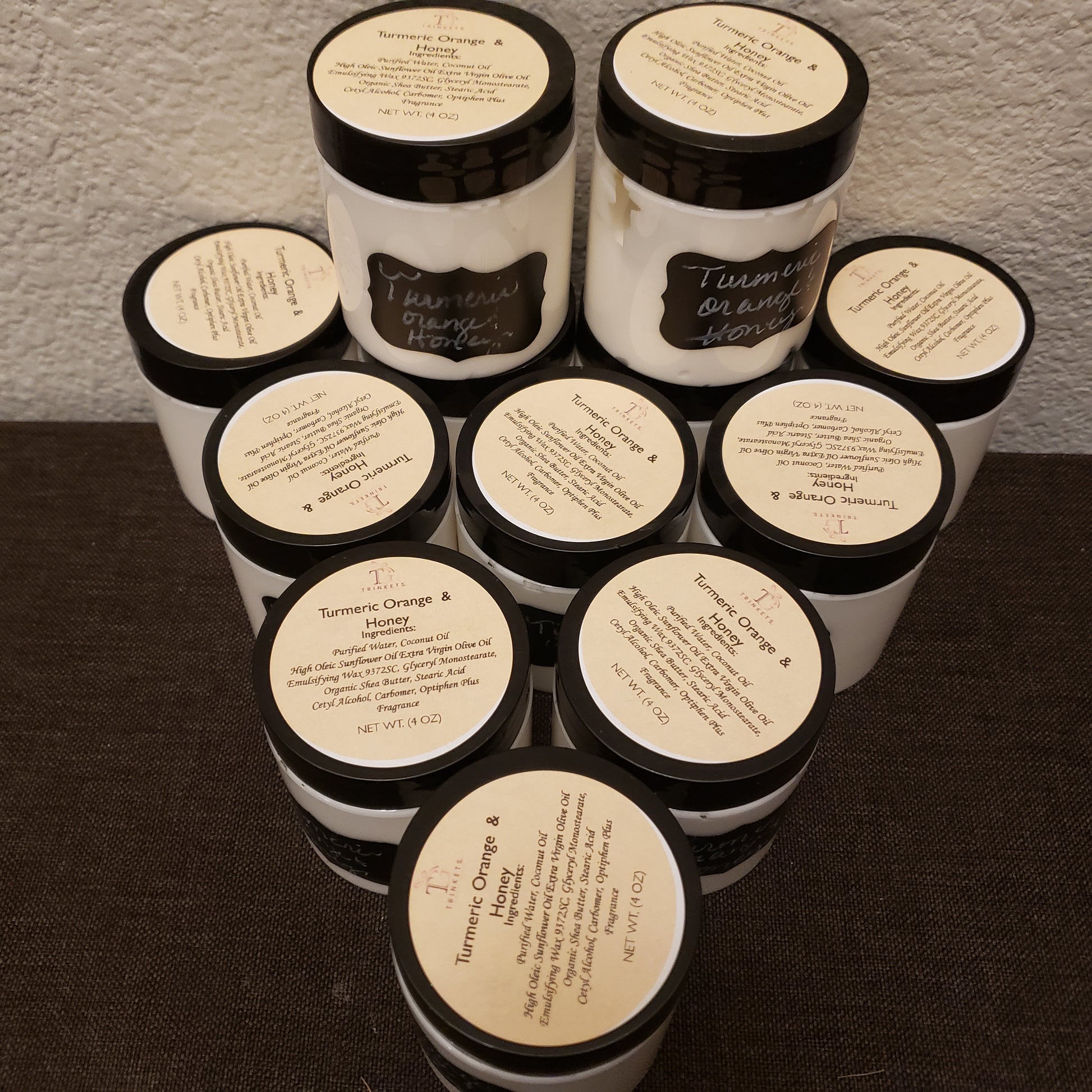 Multiple jars with labels on a textured surface